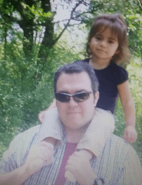 Me with a grand-kid back in 2014 on a summer walk in the woods.